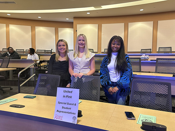 Trio of students from the grant writing course posing before their presentation.
